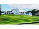 Community clubhouse set on a grassy hill at 3006 Cambridge Hill Dr, Dacula, GA 30019