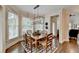 Dining room with natural light, a stylish light fixture, and hardwood floors at 3006 Cambridge Hill Dr, Dacula, GA 30019