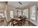Bright dining room featuring a modern light fixture and bay windows at 3006 Cambridge Hill Dr, Dacula, GA 30019