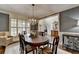 Stylish dining area with a modern chandelier, classic furniture, and neutral decor at 3006 Cambridge Hill Dr, Dacula, GA 30019