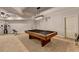 Spacious game room with a pool table, gym equipment, and neutral carpeting at 3006 Cambridge Hill Dr, Dacula, GA 30019