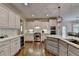 Gourmet kitchen with stainless steel appliances, white cabinetry, and a tile backsplash at 3006 Cambridge Hill Dr, Dacula, GA 30019