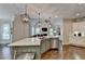 Bright kitchen featuring a large island with stainless steel appliances and hardwood floors at 3006 Cambridge Hill Dr, Dacula, GA 30019