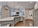 Bright, open kitchen with a large island, stainless steel appliances, and modern lighting at 3006 Cambridge Hill Dr, Dacula, GA 30019