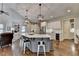 Open kitchen with a large island, white cabinets, and stainless steel appliances at 3006 Cambridge Hill Dr, Dacula, GA 30019