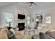 Elegant living room with fireplace, comfortable seating, and stylish decor creating a cozy atmosphere at 3006 Cambridge Hill Dr, Dacula, GA 30019