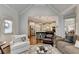Open-concept living room with a view of the kitchen, showcasing a seamless flow and inviting design at 3006 Cambridge Hill Dr, Dacula, GA 30019