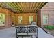 Covered outdoor patio area featuring furniture and brick wall at 3006 Cambridge Hill Dr, Dacula, GA 30019