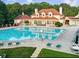 Community pool with lounge chairs, mature trees, and ample space for relaxation at 3006 Cambridge Hill Dr, Dacula, GA 30019