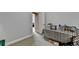 Versatile room with neutral carpet and a convenient table with a colorful tablecloth at 3006 Cambridge Hill Dr, Dacula, GA 30019