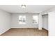 Inviting bedroom with plush carpeting, and plenty of natural light from two windows at 735 Crestwell Sw Cir, Atlanta, GA 30331