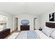Bedroom featuring a large window and en suite bathroom, neutral wall color, and carpeted floors at 735 Crestwell Sw Cir, Atlanta, GA 30331