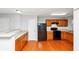 Bright kitchen featuring wood cabinets, stainless steel appliances, and hardwood flooring at 735 Crestwell Sw Cir, Atlanta, GA 30331