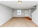 Bright living room with carpet, a large window and fresh, neutral paint at 735 Crestwell Sw Cir, Atlanta, GA 30331
