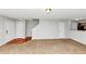 Open floor plan with carpet in living area with hardwood transition to kitchen at 735 Crestwell Sw Cir, Atlanta, GA 30331