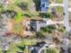 Overhead view of a home and its surroundings showcasing a lush backyard and neighborhood layout at 7750 Silversmith Dr, Cumming, GA 30028