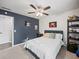Cozy bedroom featuring a ceiling fan, plush carpet, and playful decor at 7750 Silversmith Dr, Cumming, GA 30028