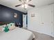 The bedroom features plush carpet and a dark accent wall at 7750 Silversmith Dr, Cumming, GA 30028