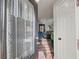 Inviting home entryway featuring a decorative glass door, wood floors and an open living space at 7750 Silversmith Dr, Cumming, GA 30028