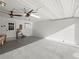 Spacious garage with ample storage space, door to backyard, and a fan at 7750 Silversmith Dr, Cumming, GA 30028