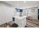 Bright kitchen features white cabinets and island, stainless appliances, and adjacent dining area with natural light at 7750 Silversmith Dr, Cumming, GA 30028