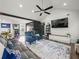 Living room featuring comfortable seating, vaulted ceilings, and plenty of natural light at 7750 Silversmith Dr, Cumming, GA 30028