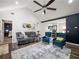 An open-concept living room offers a comfortable seating area and a view into other rooms at 7750 Silversmith Dr, Cumming, GA 30028
