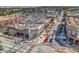 Aerial view showcasing a bustling retail center and a busy street with many parked cars and storefronts at 20 Screven Ne St, Atlanta, GA 30307