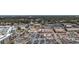 Wide aerial view showcasing a bustling retail center, surrounded by roads, trees, and tall buildings on the horizon at 20 Screven Ne St, Atlanta, GA 30307