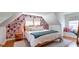 Inviting bedroom with floral wallpaper and hardwood floors, creating a cozy retreat at 20 Screven Ne St, Atlanta, GA 30307