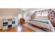 Bright bedroom with floral wallpaper, hardwood floors, and natural light at 20 Screven Ne St, Atlanta, GA 30307