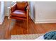 Bright bedroom featuring hardwood floors and a stylish leather chair at 20 Screven Ne St, Atlanta, GA 30307