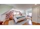 Inviting bedroom with floral wallpaper and hardwood floors, creating a cozy retreat at 20 Screven Ne St, Atlanta, GA 30307