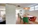 Charming dining area featuring a stylish table, statement light fixture and decorative brick details at 20 Screven Ne St, Atlanta, GA 30307