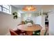 Stylish dining area features a round table, designer lighting, and natural light from multiple windows at 20 Screven Ne St, Atlanta, GA 30307