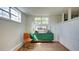 The dining room has natural light, with a modern green buffet and a brick partition wall at 20 Screven Ne St, Atlanta, GA 30307