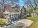 Charming home featuring a brick facade, a cozy patio, a lush lawn, and a storage shed surrounded by trees at 20 Screven Ne St, Atlanta, GA 30307