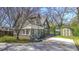 Charming cottage-style home with a landscaped front yard, brick foundation and a private driveway at 20 Screven Ne St, Atlanta, GA 30307