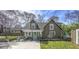 Charming cottage-style home with a landscaped front yard, brick foundation and a private driveway at 20 Screven Ne St, Atlanta, GA 30307