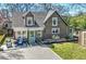 Charming home featuring a brick facade, a cozy patio, a lush lawn, and a storage shed on a sunny day at 20 Screven Ne St, Atlanta, GA 30307