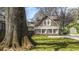 Charming house exterior showing a well-maintained lawn, complemented by mature trees and a convenient storage shed at 20 Screven Ne St, Atlanta, GA 30307