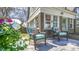 Inviting outdoor patio seating area with comfortable wicker chairs, perfect for relaxing and enjoying the view at 20 Screven Ne St, Atlanta, GA 30307