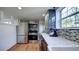 Bright modern kitchen featuring stainless steel appliances and mosaic backsplash with a view to the dining room at 20 Screven Ne St, Atlanta, GA 30307
