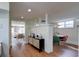 Bright living room featuring hardwood floors, decorative brick, and an open layout at 20 Screven Ne St, Atlanta, GA 30307