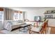 Stylish living room featuring a whitewashed brick wall, modern decor, and comfortable seating arrangements at 20 Screven Ne St, Atlanta, GA 30307