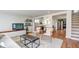 Open-concept living room boasts a comfortable seating area and seamless access to the kitchen at 20 Screven Ne St, Atlanta, GA 30307