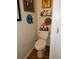 A bathroom with a standard toilet and decorative artwork at 315 Saratoga Pl, Riverdale, GA 30296