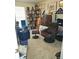 A bedroom with a comfortable chair, shelves, and dresser at 315 Saratoga Pl, Riverdale, GA 30296