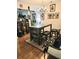 A dining area featuring a bar-height table with storage and eclectic artwork at 315 Saratoga Pl, Riverdale, GA 30296