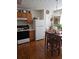 A kitchen and dining area featuring a refrigerator and a wooden table at 315 Saratoga Pl, Riverdale, GA 30296